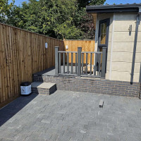 Decked area for a garden outhouse