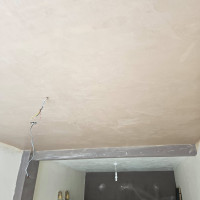 Plastering a ceiling