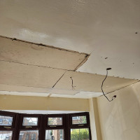Plasterboarding a ceiling