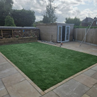Artificial grass installed in a section of a garden